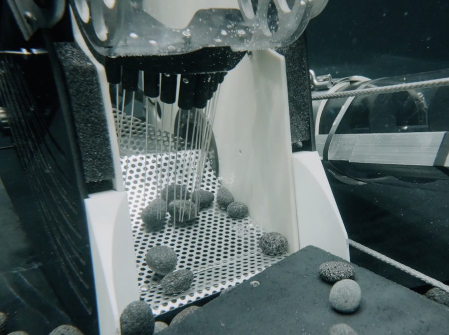 Close-up of the collector's comb mechanism sorting nodules during FIU tank testing